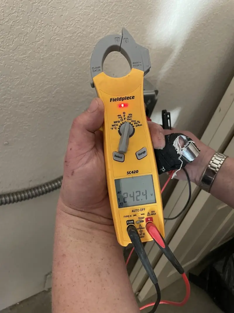 Voltage testing with clamp meter during Aluminum Wiring Replacement in San Manuel